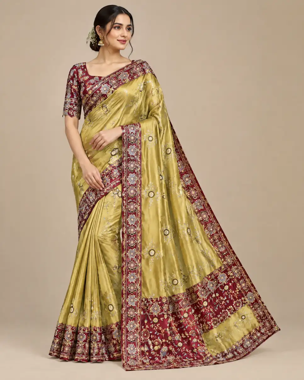 Embroidered Rangoli Silk Saree Set Gold And Maroon main Embroidered Rangoli silk saree set with matching stitched blouse and cut-work lace border in multiple colourways.